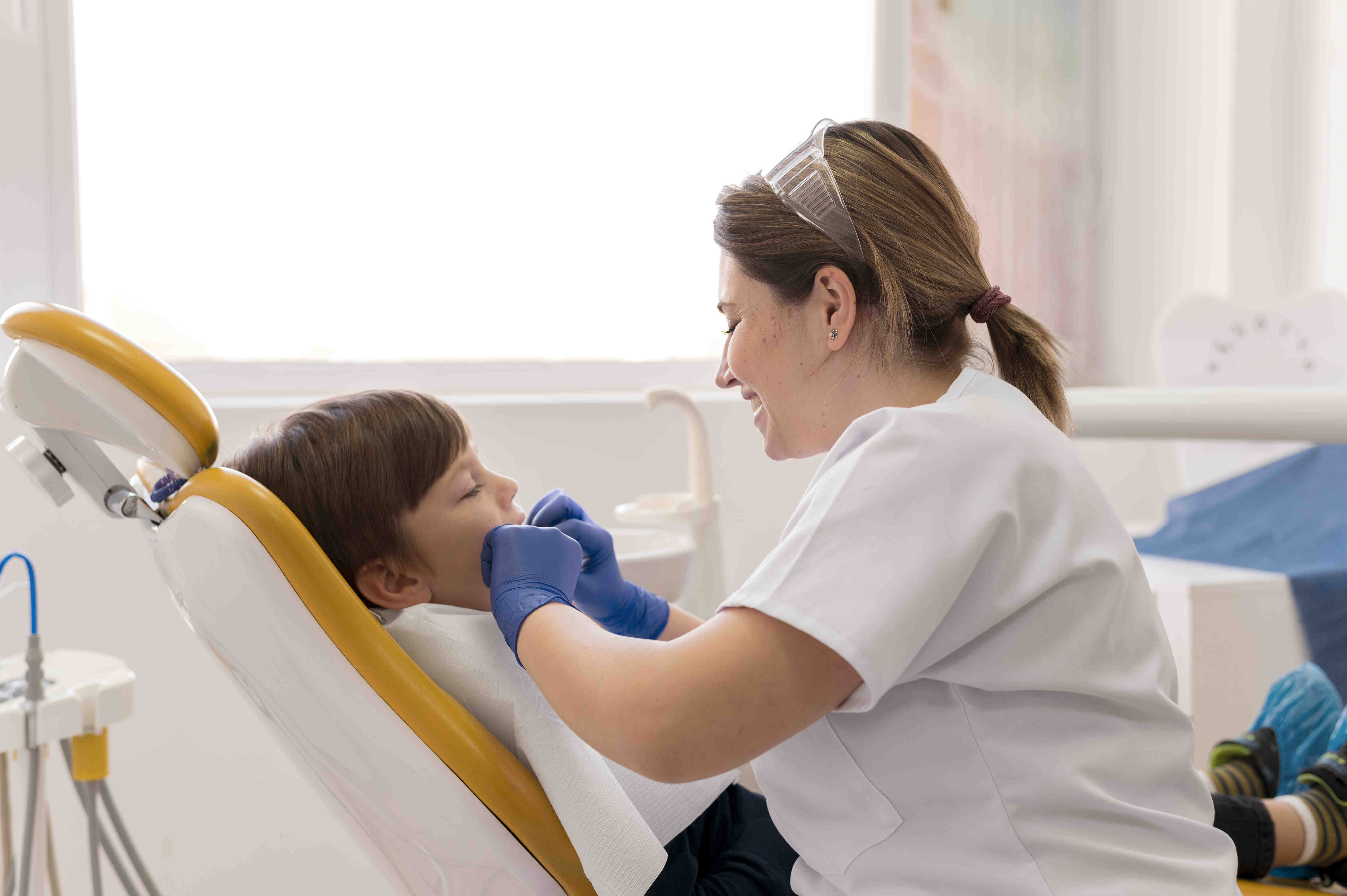 dentist-cleaning-child-s-teeth-1-1